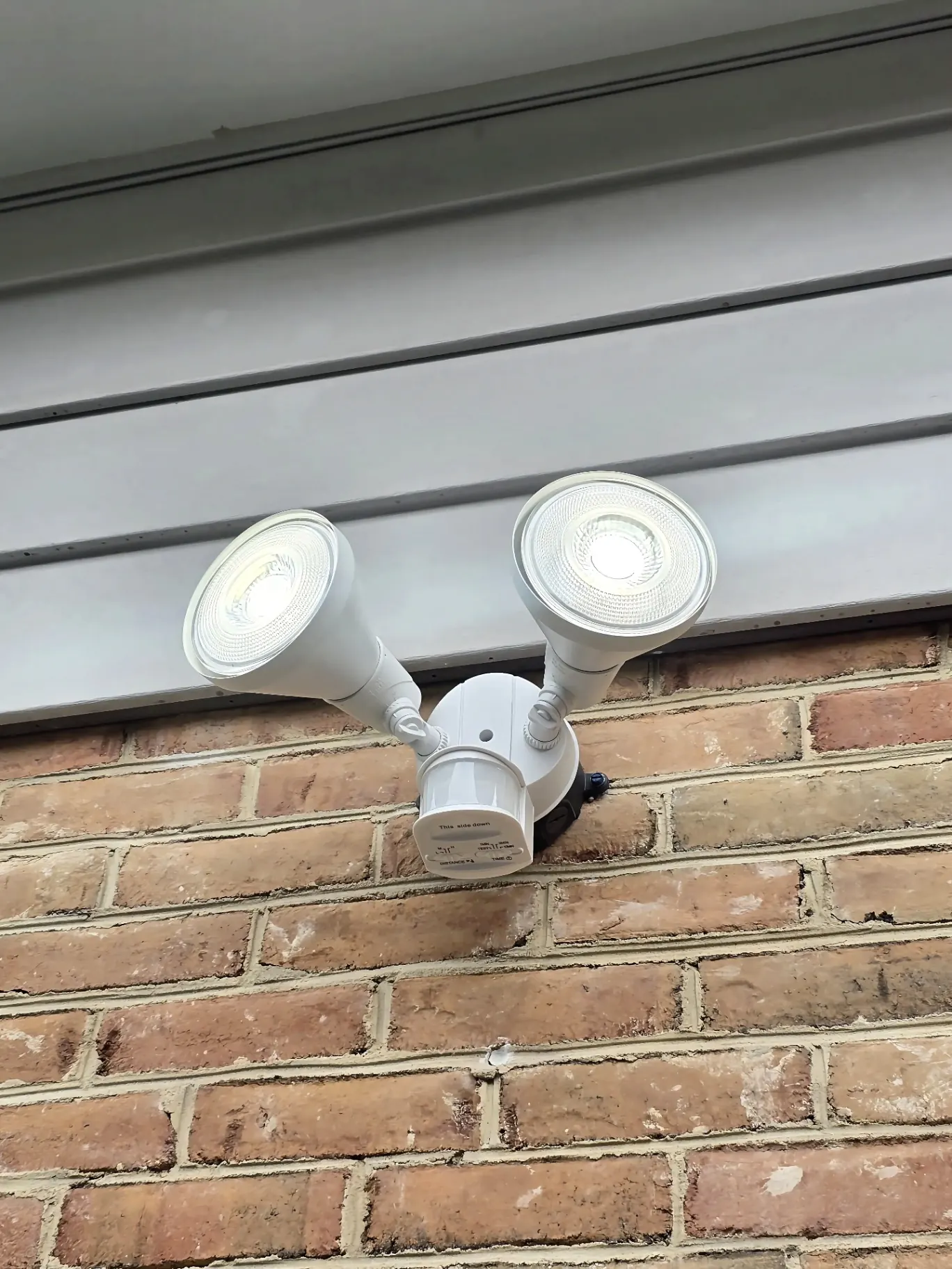 Motion-Sensor LED Flood Lights — Dual-head LED flood with integrated motion sensor — clean exterior security upgrade.