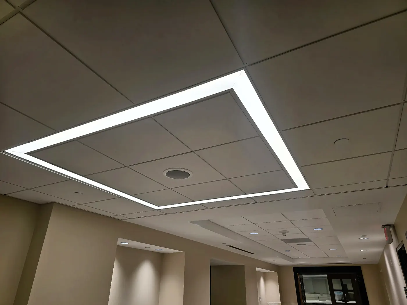 Recessed Edge-Lit Ceiling Feature — Architectural recessed edge-lit LED feature integrated into a contemporary office ceiling.