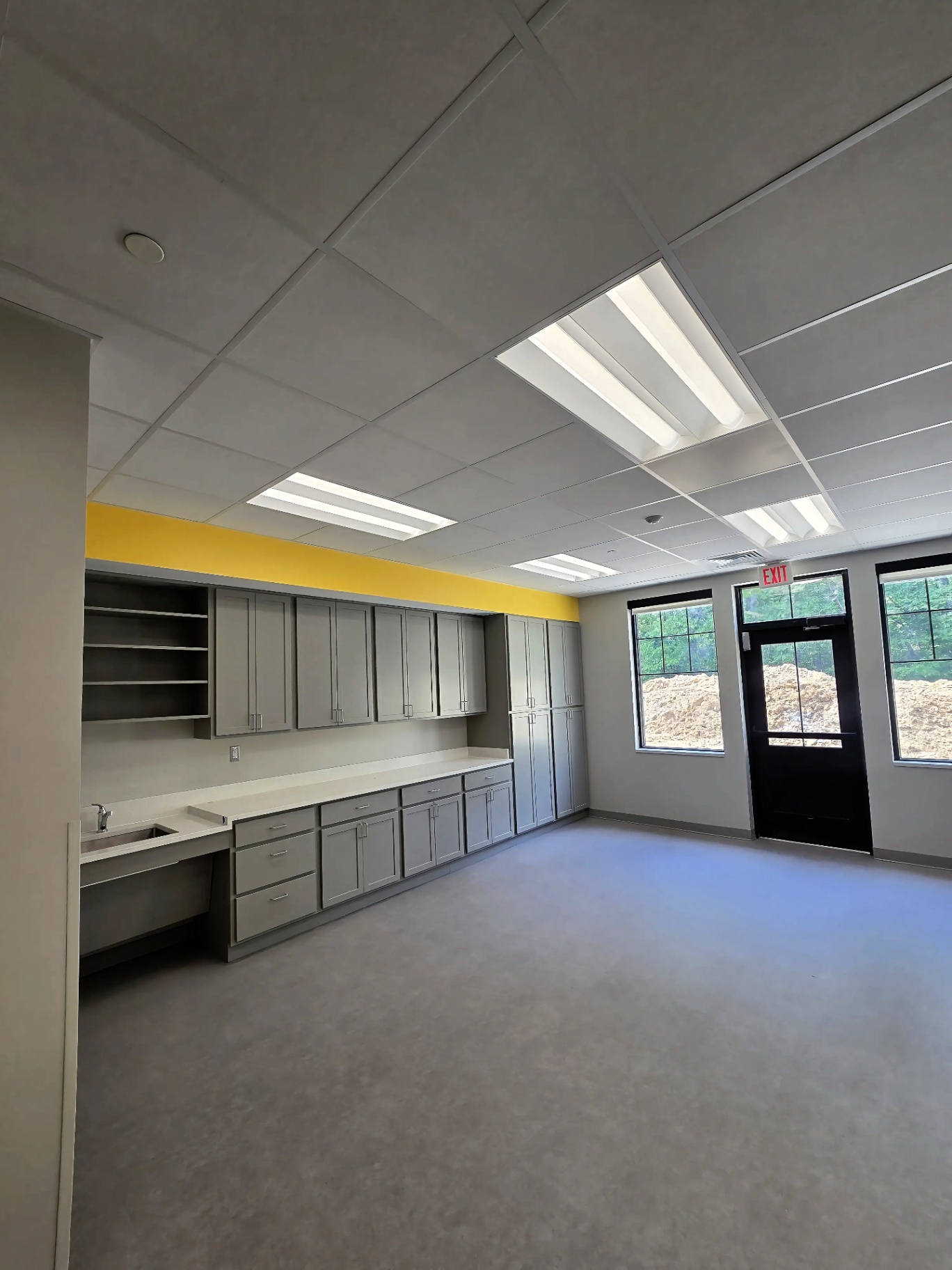 Commercial Break Room Build-Out — Troffer lighting and finished devices completing a commercial break room interior.